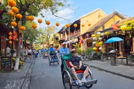 Turistas extranjeros en Hoi An. (Foto: VNA)