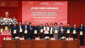 Delegados en el evento (Foto: baochinhphu.vn)