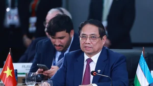 [Foto] Premier vietnamita interviene en debate de alto nivel de la Cumbre ampliada del BRICS