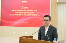 Le Quoc Minh, presidente editor del diario Nhan Dan habla en la cita (Foto: Nhan Dan)