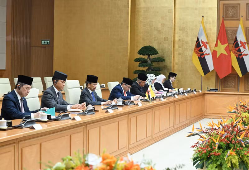 Miembros de la delegación de Brunéi acuden al evento.