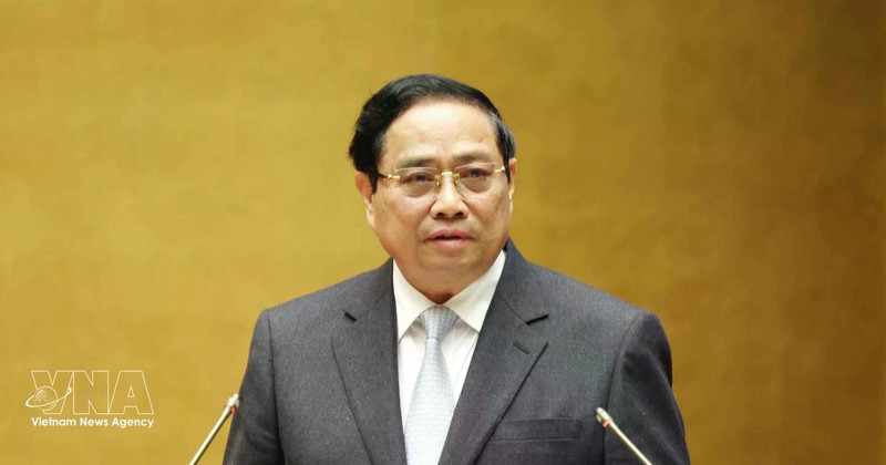 El primer ministro Pham Minh Chinh presenta el “Programa de Acción para la implementación de la Resolución del XIV Congreso Nacional del Partido”. (Foto: VNA)