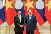 El presidente de la Asamblea Nacional de Vietnam, Tran Thanh Man, y el secretario general del PPRL y presidente de Laos, Thongloun Sisoulith. (Foto: Nhan Dan)
