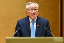 El viceprimer ministro permanente Nguyen Hoa Binh interviene presenta un informe en el marco del décimo período de sesiones de la Asamblea Nacional de la XV Legislatura. (Foto: Nhan Dan)