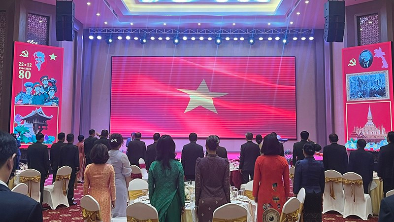 Los delegados de Vietnam y Laos en el evento (Foto: Nhan Dan)