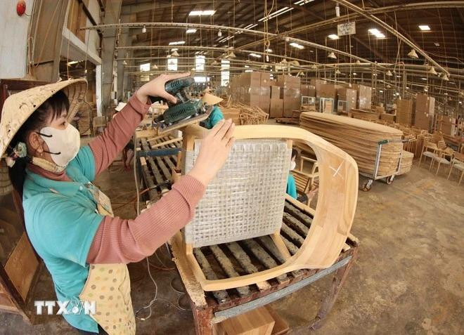En una empresa de procesamiento de madera. (Foto: VNA)