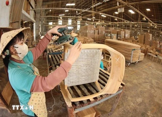 En una empresa de procesamiento de madera. (Foto: VNA)
