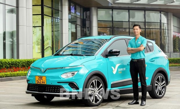 Uniforme del conductor y color del taxi estándar - GreenCar (Foto: VNA)