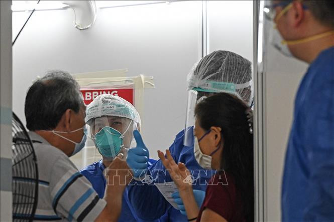 Un sitio de prueba de detección de Covid-19 en Singapur. (Fotografía: VNA)