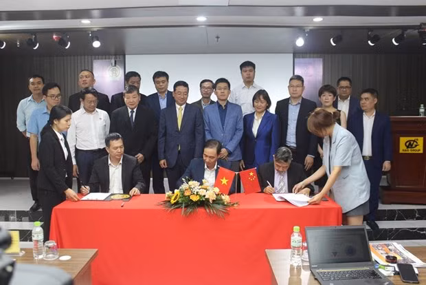 En el acto de firma. (Fotografía: VNA)