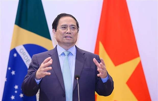 El primer ministro de Vietnam, Pham Minh Chinh, habla sobre las políticas de Vietnam. (Fotografía: VNA)