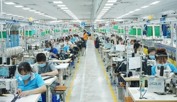 Trabajadores en la fábrica textil Bowker Vietnam, en la provincia de Binh Duong. (Fotografía: VNA)