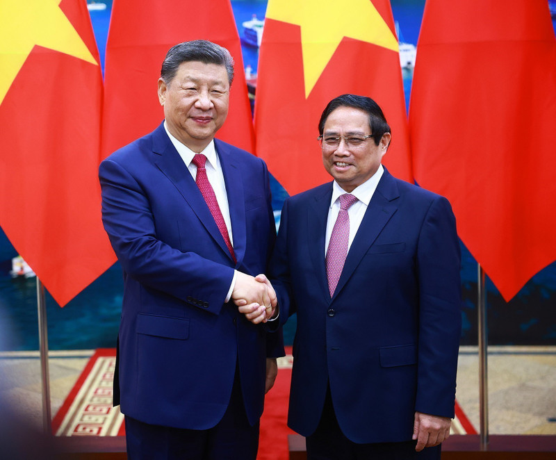 El primer ministro de Vietnam, Pham Minh Chinh (derecha), y el secretario general del Partido Comunista y presidente de China, Xi Jinping. (Fotografía: Nhan Dan)