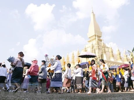 El pueblo laosiano asiste al Festival That Luang en noviembre de 2022. (Foto: VNA)