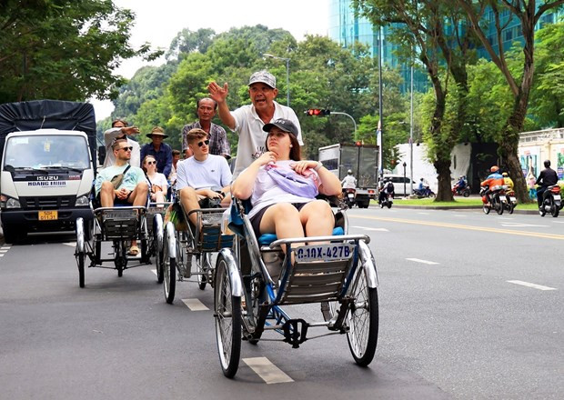 Turistas en Ciudad Ho Chi Minh. (Fotografía: VNA)