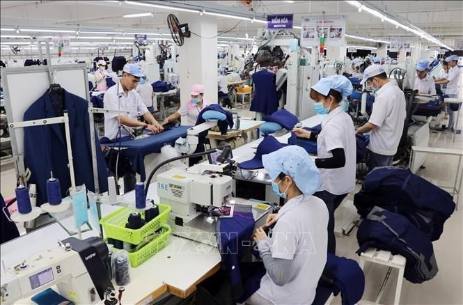 Actividades de producción de una empresa textil ubicada en la ciudad de Da Nang. (Foto: VNA)