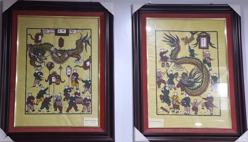 Pinturas de la antigua y nueva procesión de dragones. (Foto: VNA)