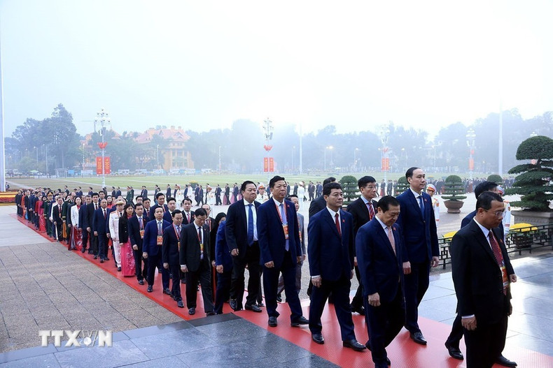 Delegados al XIV Congreso Nacional del Partido en el acto. (Foto: VNA)