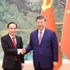 El secretario general del Partido Comunista de China (PCCh) y presidente del país, Xi Jinping, y el canciller vietnamita, Le Hoai Trung (izquierda).