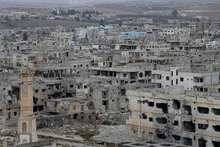 Edificios destruidos por la guerra en una zona de Siria. (Foto: Xinhua/VNA)