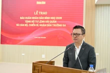 Le Quoc Minh, presidente editor del diario Nhan Dan habla en la cita (Foto: Nhan Dan)