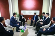 El primer ministro de Vietnam, Pham Minh Chinh, recibe a Dave West, presidente para Asia-Pacífico del grupo Cisco (Estados Unidos). (Foto: VNA)