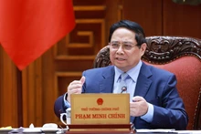 El primer ministro de Vietnam, Pham Minh Chinh, interviene en la reunión. (Foto: VNA)