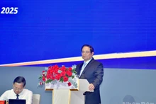 El primer ministro de Vietnam, Pham Minh Chinh, habla en la conferencia. (Foto: Nhan Dan)