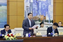 El secretario general de la Asamblea Nacional, jefe de su Oficina y titular de la Oficina del Consejo Nacional Electoral, Le Quang Manh, presenta en informe. (Foto: VNA)
