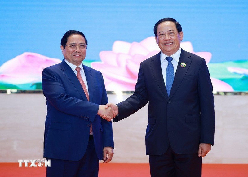 El primer ministro vietnamita, Pham Minh Chinh, y su homólogo laosiano, Sonexay Siphandone. (Foto: VNA)