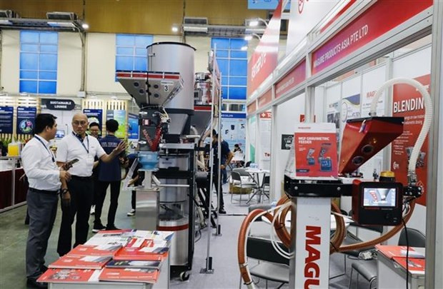 En el stand de Singapur (Fotografía: VNA)