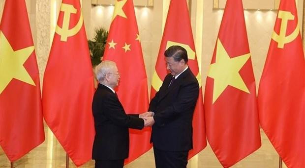 El secretario general del PCV, Nguyen Phu Trong, y el máximo dirigente partidista y presidente de China, Xi Jinping (Fotografía: VNA)