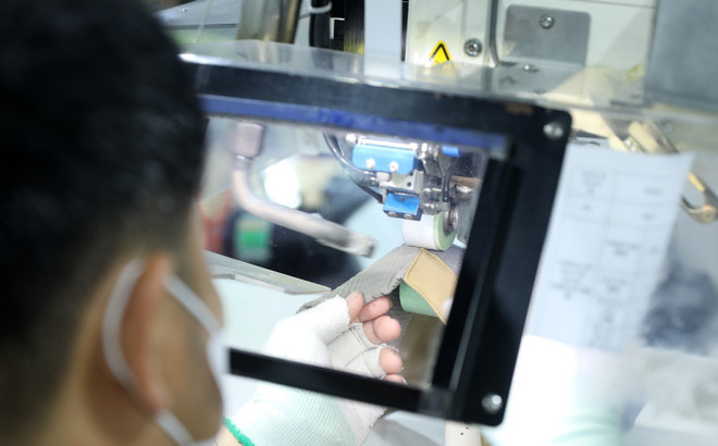 Producción de ropa deportiva de alta gama en la empresa Mensa. (Foto: VNA)