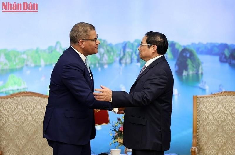 El jefe del Gobierno vietnamita y el presidente de la COP26. El jefe del Gobierno vietnamita y el presidente de la COP26.