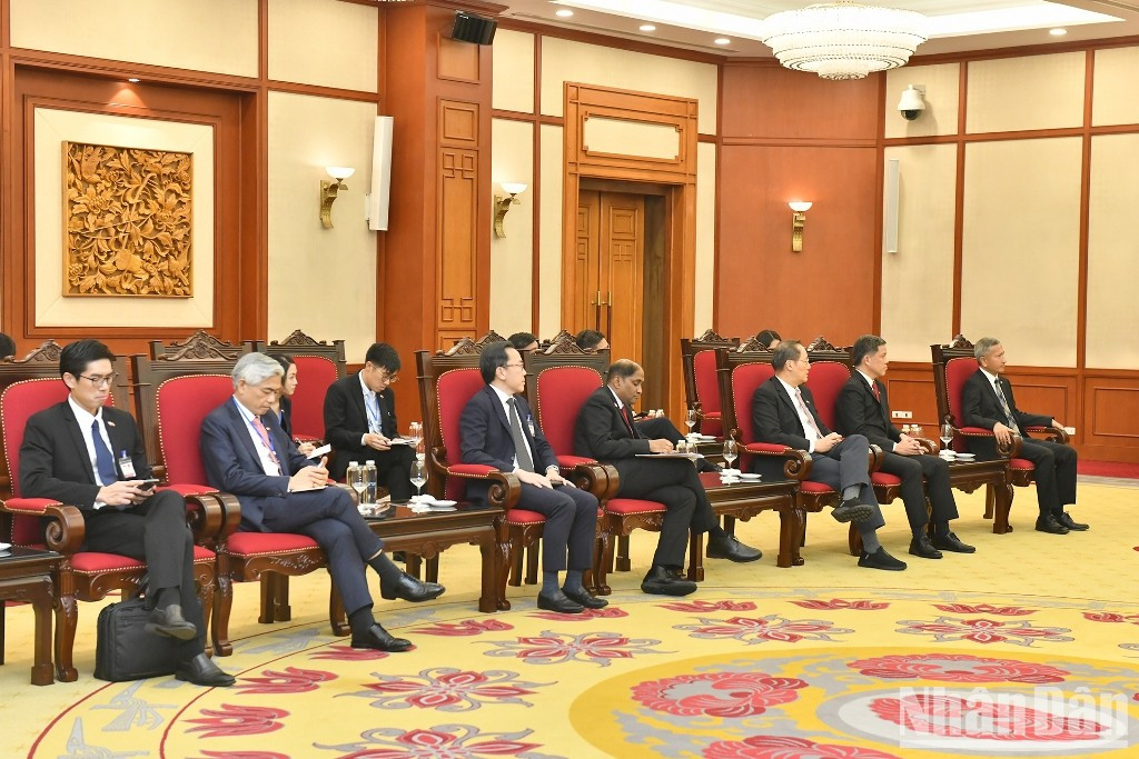 Delegados singapurenses.