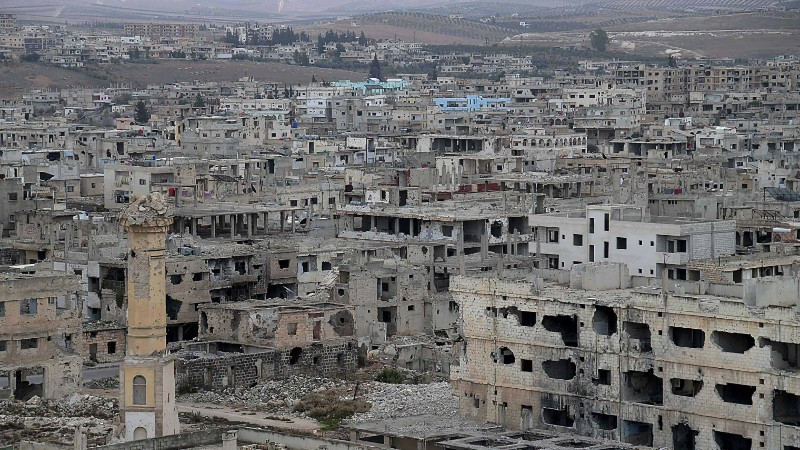 Edificios destruidos por la guerra en una zona de Siria. (Foto: Xinhua/VNA)