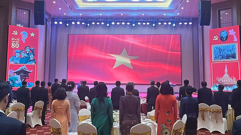 Los delegados de Vietnam y Laos en el evento (Foto: Nhan Dan)