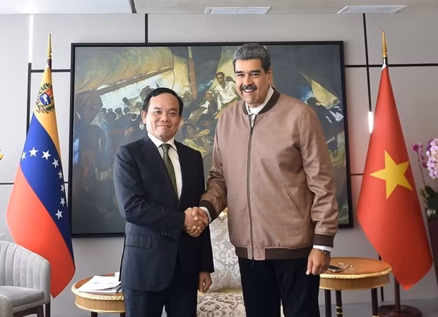 El viceprimer ministro vietnamita Tran Luu Quang y el presidente de Venezuela, Nicolás Maduro Moros. (Fotografía: VNA)