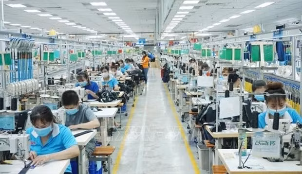 Trabajadores en la fábrica textil Bowker Vietnam, en la provincia de Binh Duong. (Fotografía: VNA)