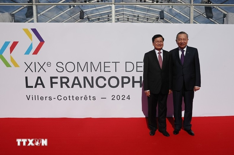 El máximo dirigente vietnamita y el secretario general del Partido Popular Revolucionario y presidente de Laos, Thongloun Sisoulith asisten al evento. El máximo dirigente vietnamita y el secretario general del Partido Popular Revolucionario y presidente de Laos, Thongloun Sisoulith asisten al evento.