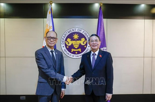 El vicepresidente de la Asamblea Nacional de Vietnam Nguyen Duc Hai en una reunión con su homólogo de Laos, Sommad Pholsena. (Fotografía: VNA)