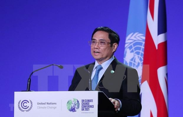 En la COP26 en noviembre de 2021, el primer ministro, Pham Minh Chinh, anunció el compromiso de Vietnam de lograr cero emisiones netas en 2050. (Fotografía: VNA) En la COP26 en noviembre de 2021, el primer ministro, Pham Minh Chinh, anunció el compromiso de Vietnam de lograr cero emisiones netas en 2050. (Fotografía: VNA)