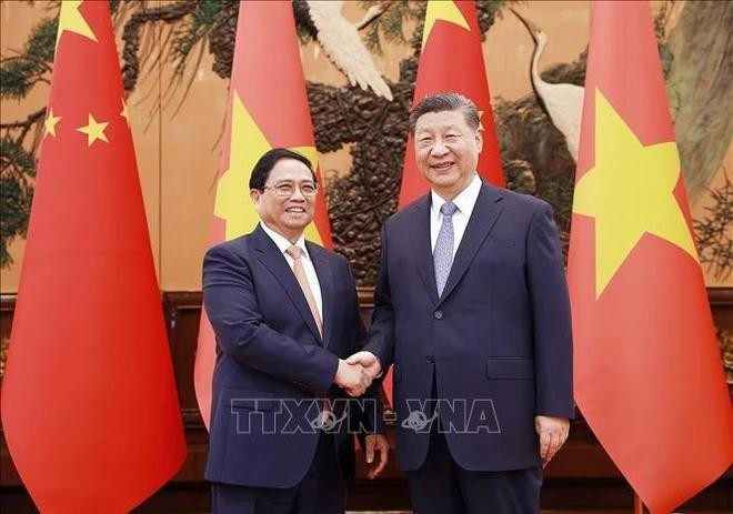 El primer ministro Pham Minh Chinh se reúne con el secretario general del Partido Comunista y presidente de China, Xi Jinping, en Beijing el 26 de junio. (Foto: VNA) El primer ministro Pham Minh Chinh se reúne con el secretario general del Partido Comunista y presidente de China, Xi Jinping, en Beijing el 26 de junio. (Foto: VNA)