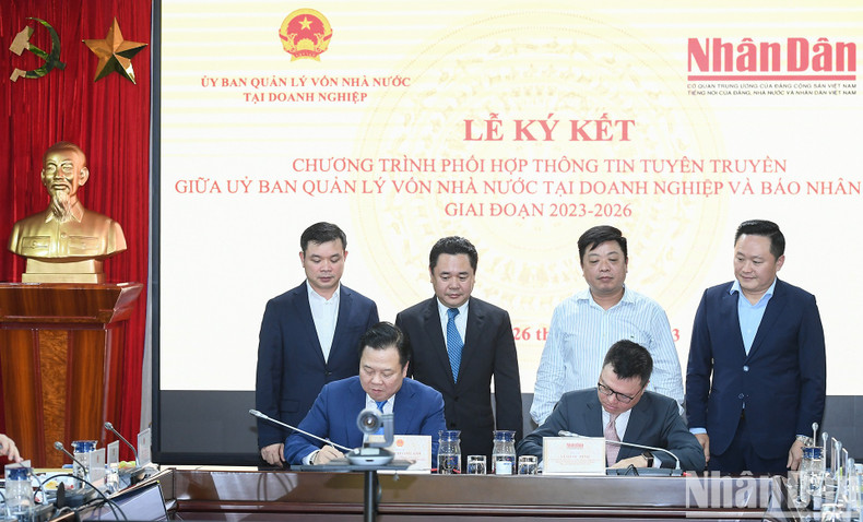 Nhan Dan y Comité de Gestión de Participación Estatal en Empresas firman acuerdo ảnh 6