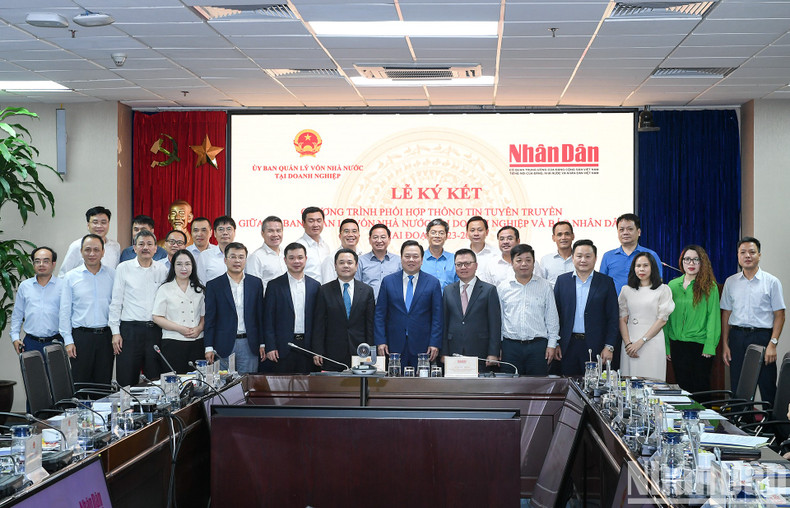 Nhan Dan y Comité de Gestión de Participación Estatal en Empresas firman acuerdo ảnh 10