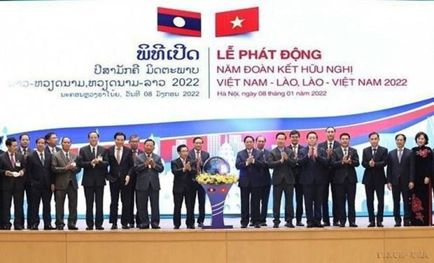 El primer ministro vietnamita, Pham Minh Chinh, y su homólogo laosiano Phankham Viphavanh en una ceremonia de inauguración del Año de la Solidaridad y la Amistad entre ambas naciones. (Fotografía:VNA) El primer ministro vietnamita, Pham Minh Chinh, y su homólogo laosiano Phankham Viphavanh en una ceremonia de inauguración del Año de la Solidaridad y la Amistad entre ambas naciones. (Fotografía:VNA)