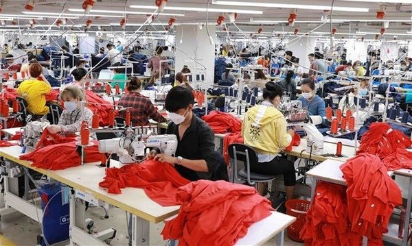 En una fábrica textil y confecciones de Vietnam. (Foto: VNA) En una fábrica textil y confecciones de Vietnam. (Foto: VNA)