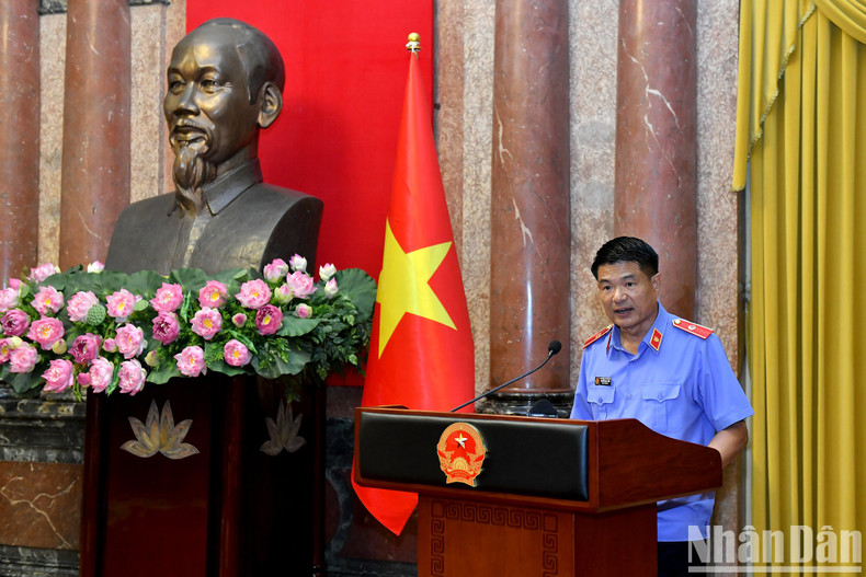 El fiscal general, Nguyen Huy Tien, habla en el evento. El fiscal general, Nguyen Huy Tien, habla en el evento.