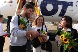 Ceremonia de bienvenida al turista internacional número 20 millones en Vietnam.