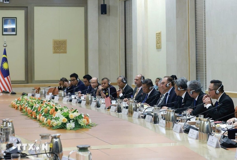 Los delegados malasios en el evento. Los delegados malasios en el evento.